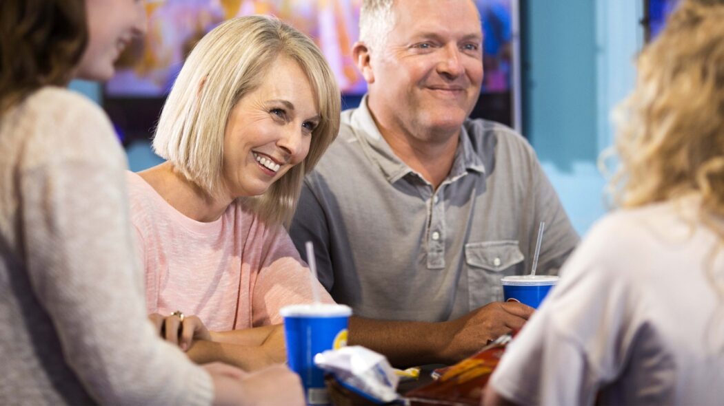 family sitting at a table enjoying non-alcoholic beverages