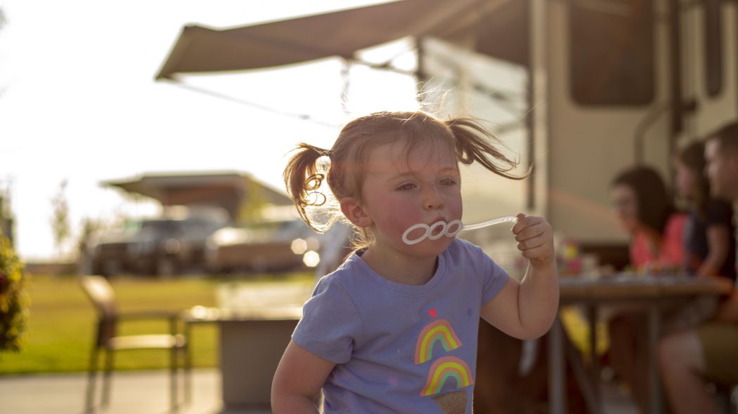 A child playing with bubbles